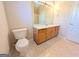 Bathroom features a vanity with wood cabinets and a toilet at 6195 Winston Trce, Mcdonough, GA 30252