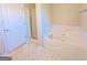Bathroom with soaking tub, shower, and updated vanity at 6195 Winston Trce, Mcdonough, GA 30252