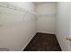Large walk-in closet with wire shelving and hanging rod at 6195 Winston Trce, Mcdonough, GA 30252