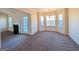 Bright dining area with bay window, fireplace, and access to kitchen at 6195 Winston Trce, Mcdonough, GA 30252