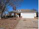 Brick house with attached garage and driveway, surrounded by trees with autumn leaves at 6195 Winston Trce, Mcdonough, GA 30252