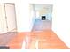 View of living room with hardwood and carpeted floors, fireplace and access to other rooms at 6195 Winston Trce, Mcdonough, GA 30252