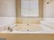 Bathroom featuring a large corner bathtub at 800 Meadowbrook Dr, Mcdonough, GA 30253