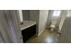 Bathroom with tub, toilet and dark vanity at 221 Lakeview Dr, Stockbridge, GA 30281