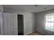 Small bedroom with closet and window at 221 Lakeview Dr, Stockbridge, GA 30281