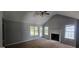 Spacious living room featuring a fireplace and vaulted ceiling at 221 Lakeview Dr, Stockbridge, GA 30281