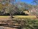 Fenced backyard with mature trees and landscaping at 120 Oakview Trce, Fayetteville, GA 30215