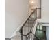 Indoor staircase with gray carpet and black railing at 2400 Campbellton Sw Rd # Apt J5, Atlanta, GA 30311