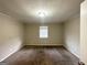 Spacious bedroom with neutral decor and carpeted floors at 4395 Stonewall Tell Rd, College Park, GA 30349