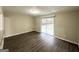Dining area with hardwood floors and sliding glass doors to backyard at 4395 Stonewall Tell Rd, College Park, GA 30349