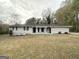 Newly renovated ranch home with a well-manicured lawn at 4395 Stonewall Tell Rd, College Park, GA 30349