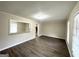 Bright living room with hardwood floors and neutral walls at 4395 Stonewall Tell Rd, College Park, GA 30349