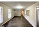 Spacious living room featuring hardwood floors and open concept at 4395 Stonewall Tell Rd, College Park, GA 30349