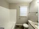 Clean bathroom with white tiled tub surround, granite vanity at 795 Nw Amber Nw Pl, Atlanta, GA 30331