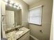 Clean bathroom, granite countertop, and window at 795 Nw Amber Nw Pl, Atlanta, GA 30331