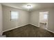 Bedroom with carpet, neutral walls, and access to laundry room at 795 Nw Amber Nw Pl, Atlanta, GA 30331