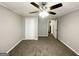 Spacious bedroom with carpet, ceiling fan, and double door closet at 795 Nw Amber Nw Pl, Atlanta, GA 30331