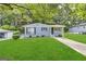 Ranch style home with gray exterior, landscaped lawn, and driveway at 795 Nw Amber Nw Pl, Atlanta, GA 30331