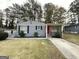 Newly painted gray ranch home with red door and well-manicured lawn at 795 Nw Amber Nw Pl, Atlanta, GA 30331