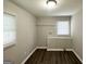 Bright laundry room with shelving and vinyl flooring at 795 Nw Amber Nw Pl, Atlanta, GA 30331