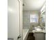Updated bathroom with granite vanity and marble tile at 2442 Graywall St, East Point, GA 30344