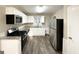 Eat-in kitchen with stainless steel appliances and granite countertops at 2442 Graywall St, East Point, GA 30344