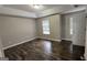 Well-lit bedroom with hardwood floors and neutral decor at 1768 Glen View Way, Hampton, GA 30228