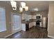 Modern kitchen with stainless steel appliances and granite countertops at 1768 Glen View Way, Hampton, GA 30228