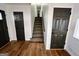 Staircase with dark doors and hardwood floors at 473 Amy Blvd, Temple, GA 30179