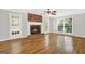 Living room with hardwood floors, fireplace, and french door at 577 Charing Cross Dr, Marietta, GA 30066