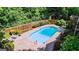 Refreshing oval pool with diving board, steps and landscaping at 577 Charing Cross Dr, Marietta, GA 30066