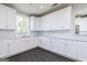 Modern white kitchen with stainless steel appliances and subway tile at 1004 Claas Way, Locust Grove, GA 30248