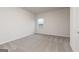 Well-lit bedroom featuring carpet and a window at 1012 Claas Way, Locust Grove, GA 30248