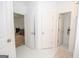 Bathroom hallway with access to multiple rooms and closets at 313 Dingler Rd, Moreland, GA 30259