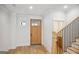 Light and bright entryway with a wooden door and hardwood floors at 618 Bellemeade Dr, Marietta, GA 30008