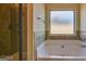 Bathroom features garden tub and walk-in shower at 643 Besra Dr, Grayson, GA 30017