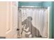 Bathroom with shower/tub combo and dinosaur shower curtain at 2744 Amber Springs Way, Buford, GA 30519