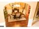 Formal dining room with hardwood floors, chandelier, and decorative accents at 80 Tanners Ct, Covington, GA 30016