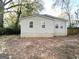Home exterior view with backyard and wooden fence at 3444 Orchard Cir, Decatur, GA 30032