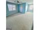 Light blue bedroom with ceiling fan and carpet flooring at 3254 Paul Harris Rd, Dallas, GA 30157