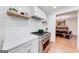 Modern kitchen with white cabinets, stainless steel appliances, and a farmhouse sink at 442 Summit Ridge Dr, Lawrenceville, GA 30046