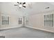 Bright bedroom featuring wall-to-wall carpeting and three windows at 5760 Winding Lakes Dr, Cumming, GA 30028