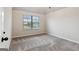 Spacious bedroom with carpeted floor and window at 5760 Winding Lakes Dr, Cumming, GA 30028