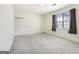 Bright bedroom with window and wall-mounted shelf at 220 Jeff Davis Pl, Fayetteville, GA 30214