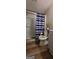 Clean bathroom with shower, toilet and wood-look flooring at 174 Sherwood Loop, Mcdonough, GA 30253