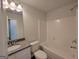 Clean bathroom, granite vanity, and shower/tub combo at 7238 Crestside Dr # 79, Austell, GA 30168