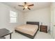 Comfortable bedroom with ceiling fan and ample space at 413 Kinross Ln, Peachtree City, GA 30269