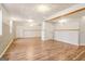 Large finished basement area with wood-look floors and neutral walls at 262 French Village Blvd, Sharpsburg, GA 30277