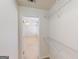 Bedroom walk-in closet with wire shelving at 6383 Edgewater Cv, Fairburn, GA 30213