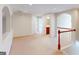 Upstairs hallway with carpeted floor and access to a bathroom at 6383 Edgewater Cv, Fairburn, GA 30213